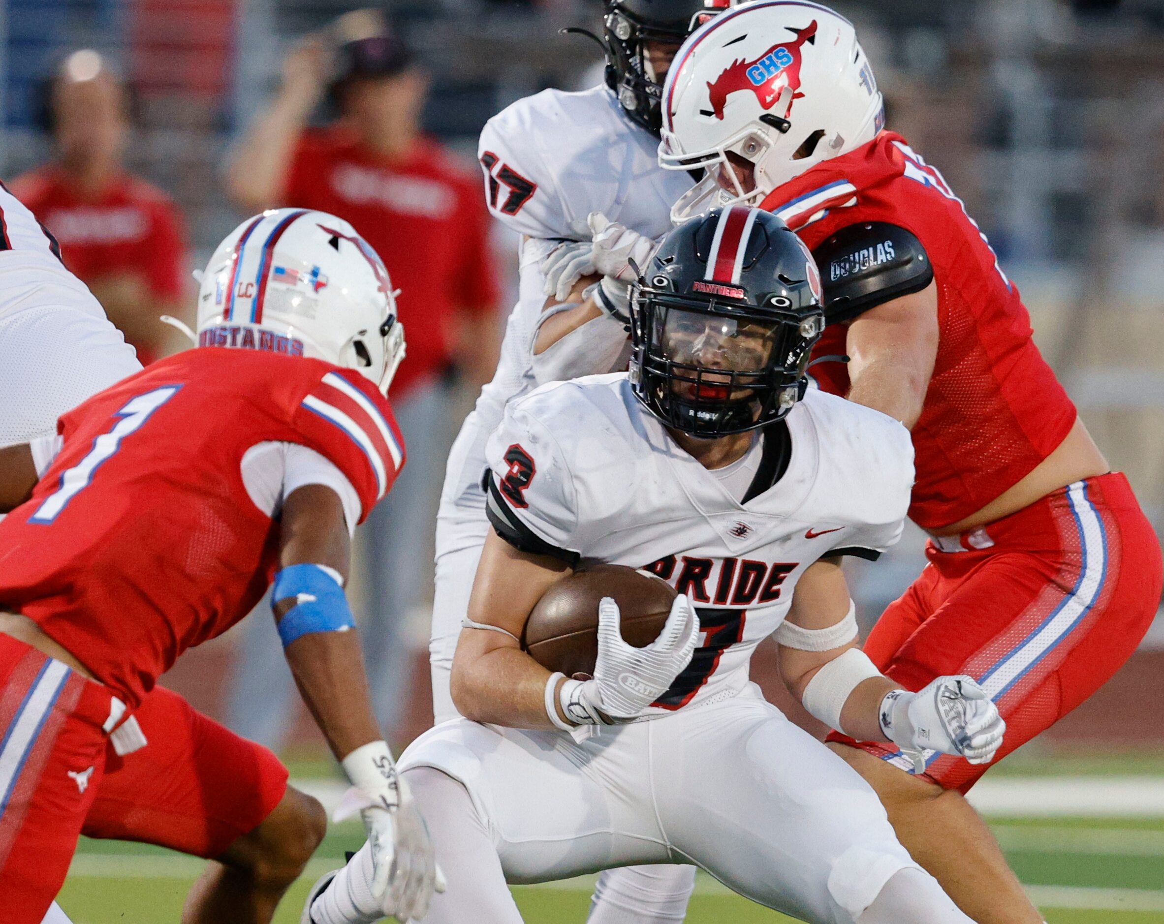 Colleyville Heritage's Ryan Keleher (3) keeps a ball away from Grapevine's Bryson Davis (1)...