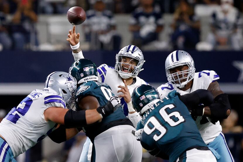 Dallas Cowboys quarterback Dak Prescott (4) releases a pass over the Philadelphia Eagles...