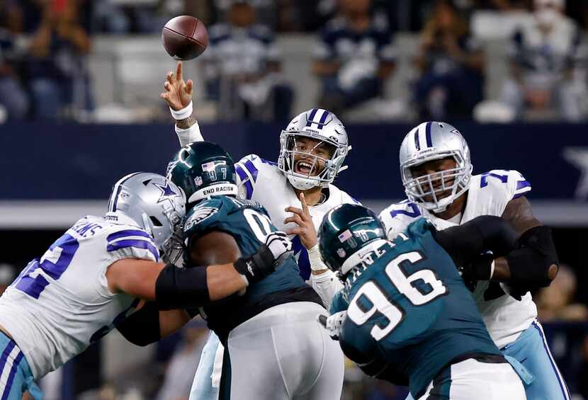 Dallas Cowboys quarterback Dak Prescott (4) releases a pass over the Philadelphia Eagles...