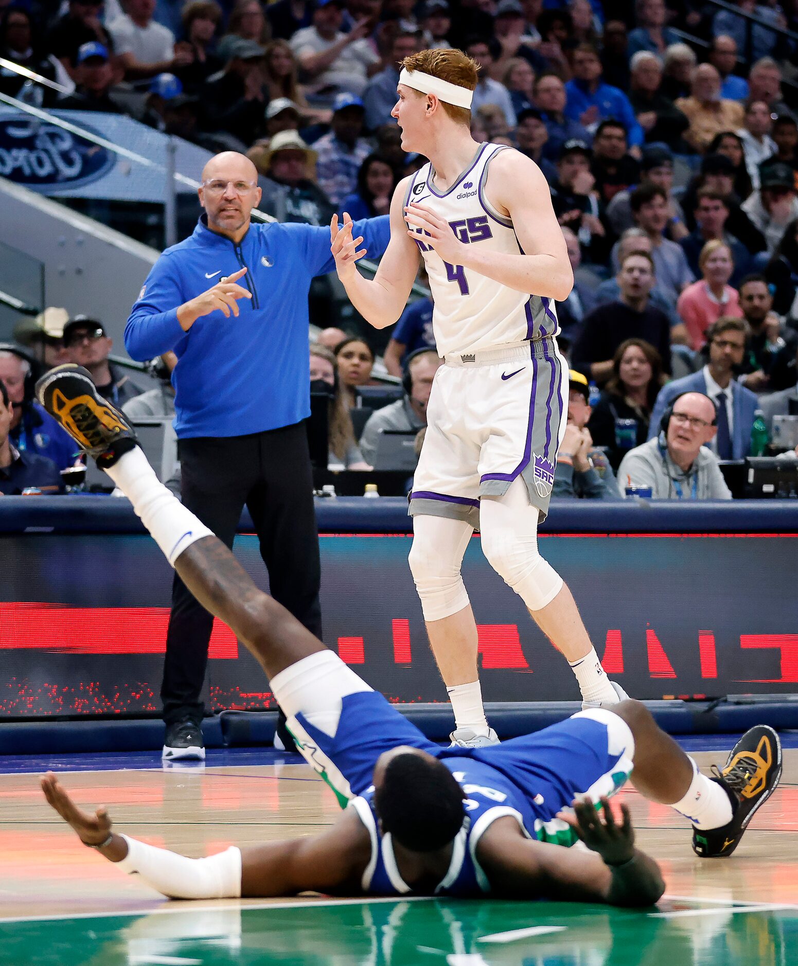 Sacramento Kings guard Kevin Huerter (9) reacts to fouling Dallas Mavericks forward Tim...