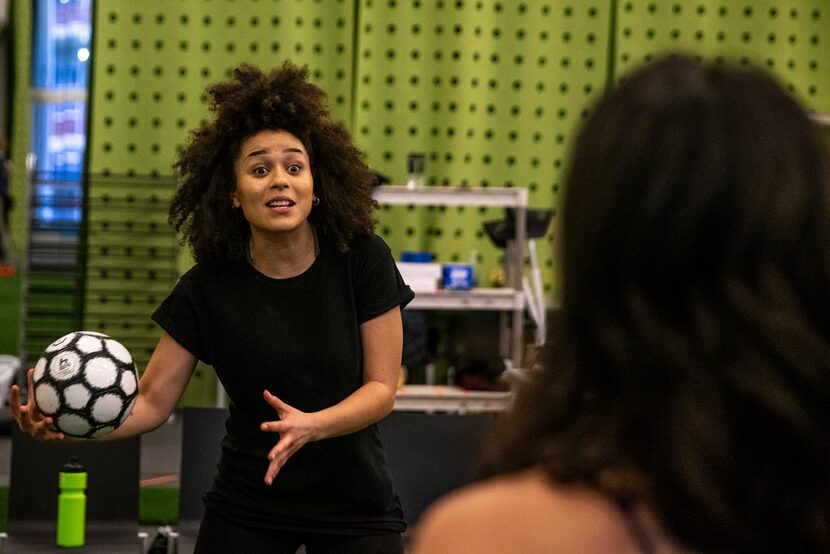 Lauren Steele practices her soccer skills with Elena Urdaneta during a rehearsal for The...