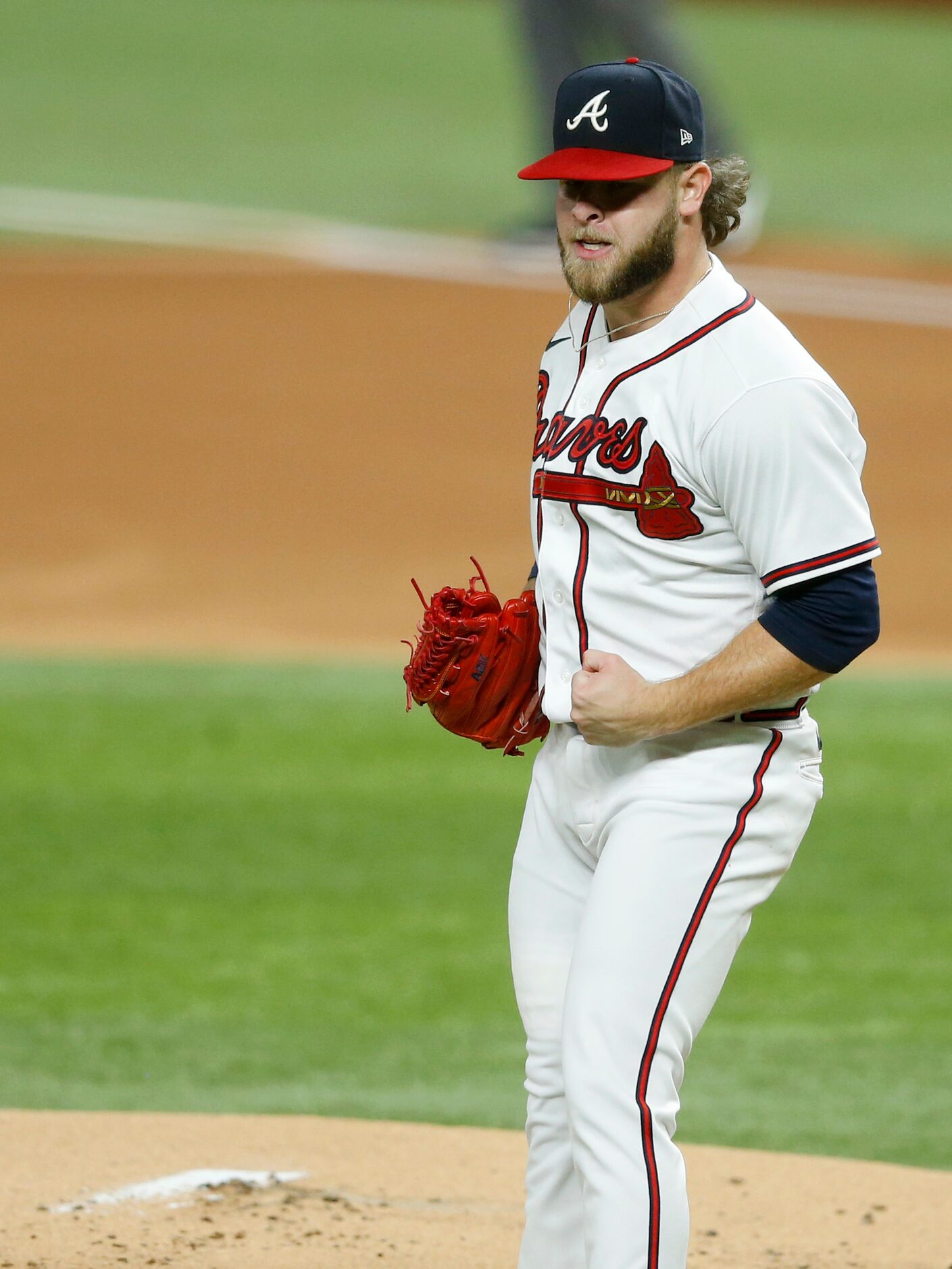 Atlanta Braves relief pitcher A.J. Minter (33) celebrates after getting the last out of the...