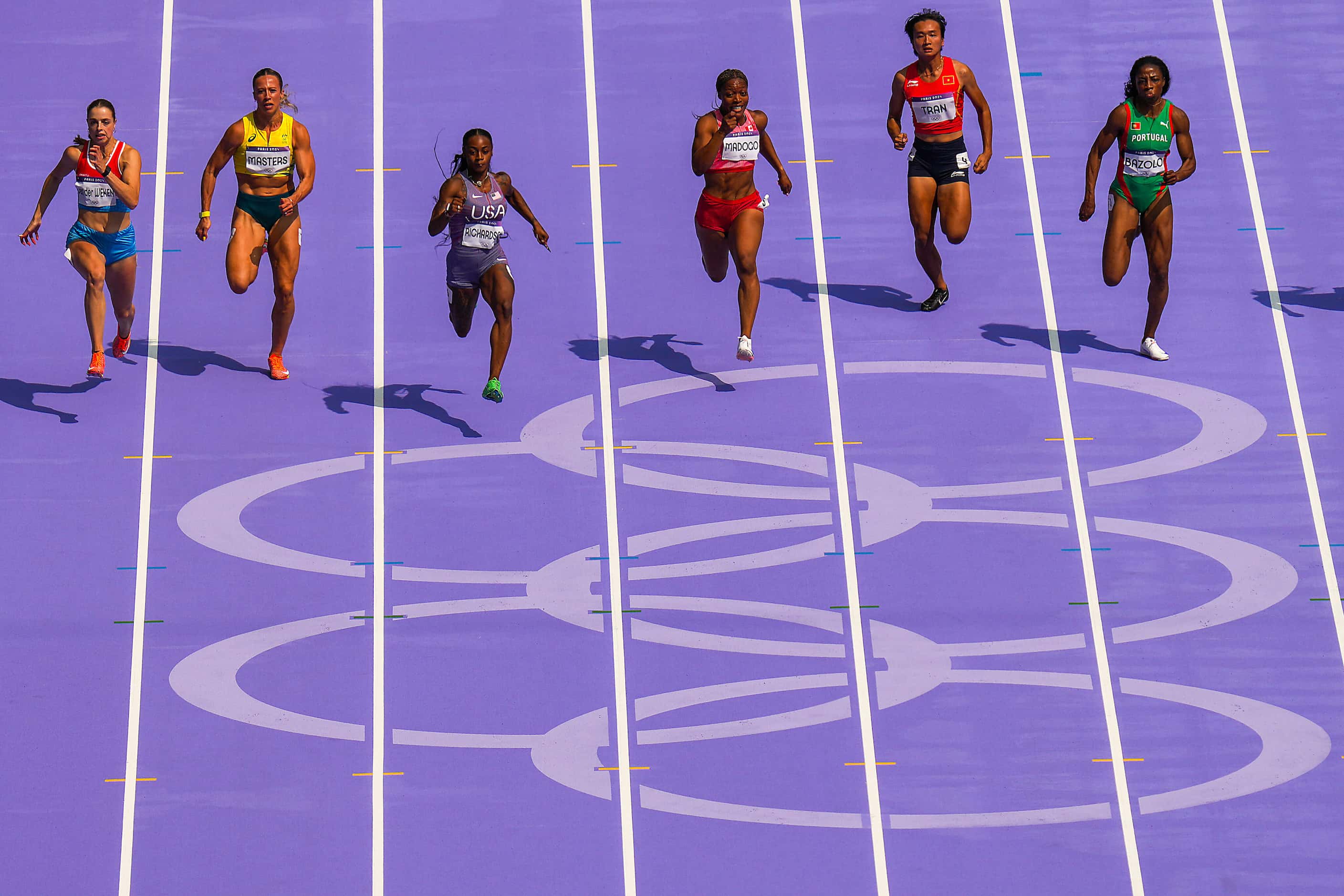 Sha'carri Richardson of the United States (second from left) leads the field on her way to...