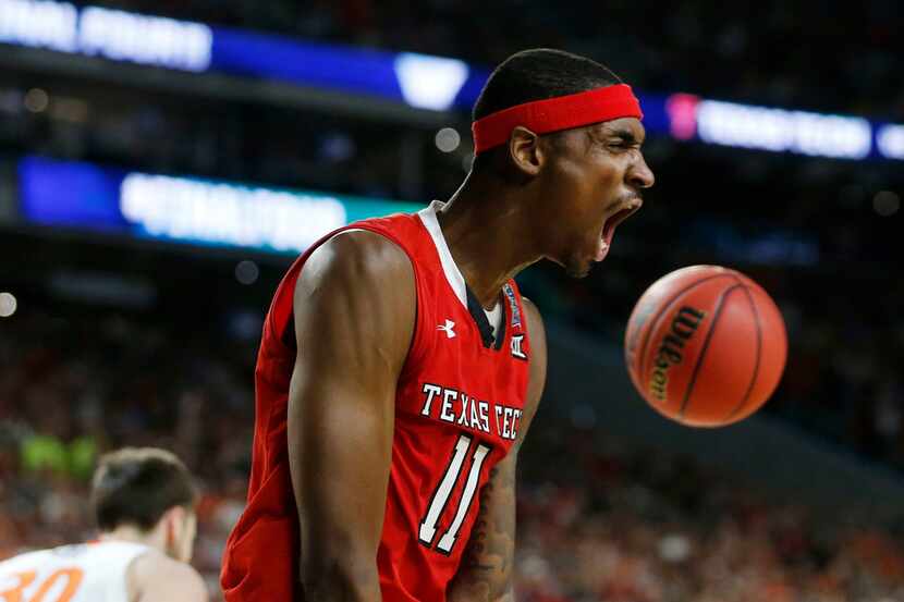 Texas Tech Red Raiders forward Tariq Owens (11) celebrates after dunking the ball in front...
