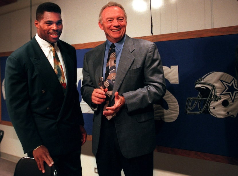 7/11/96--Dallas Cowboys' owner Jerry Jones ( right) smiles as he chats with new Cowboy...