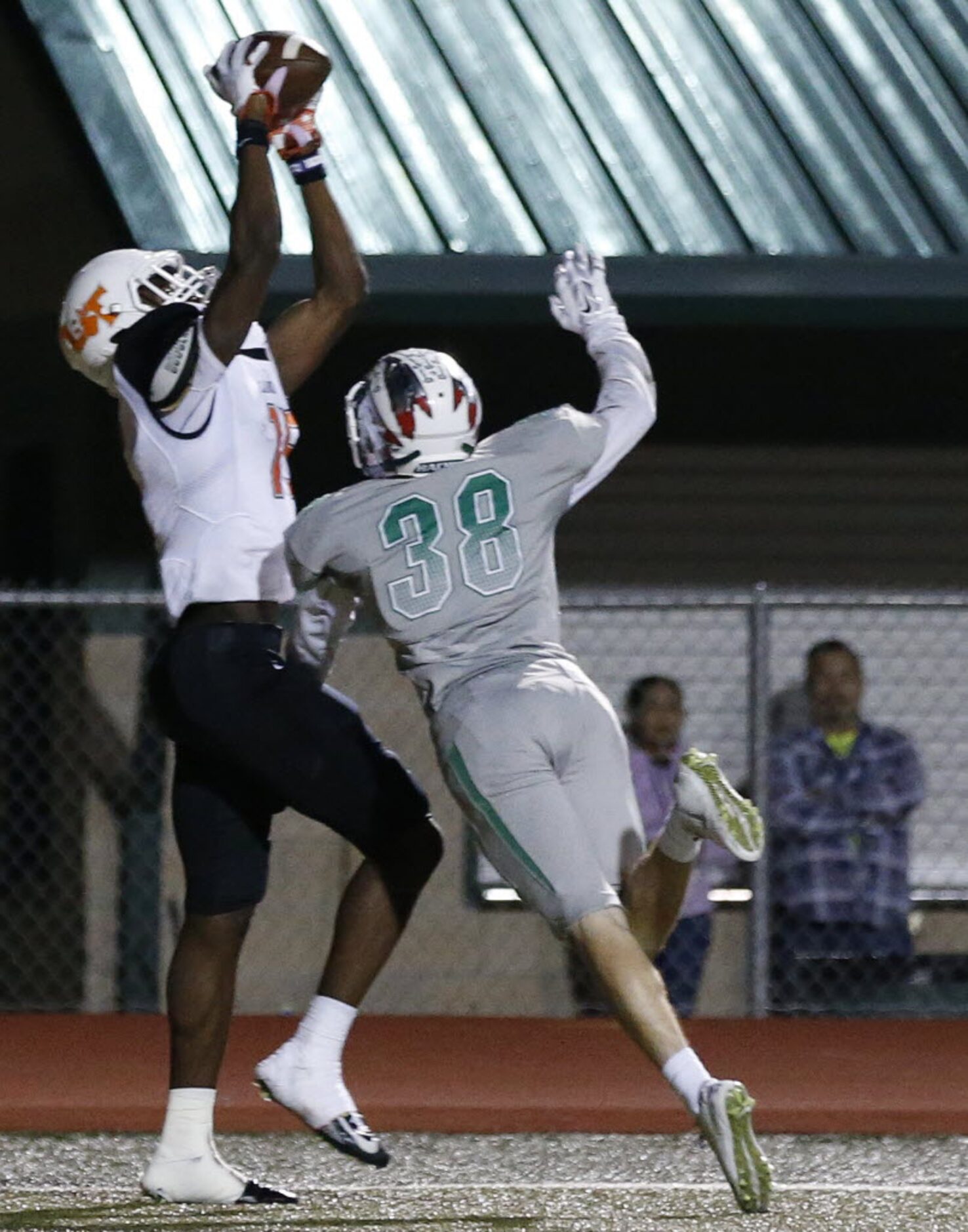 Lancaster wide receiver Omar Manning (15) catches a pass for a touchdown over a Waxahachie...