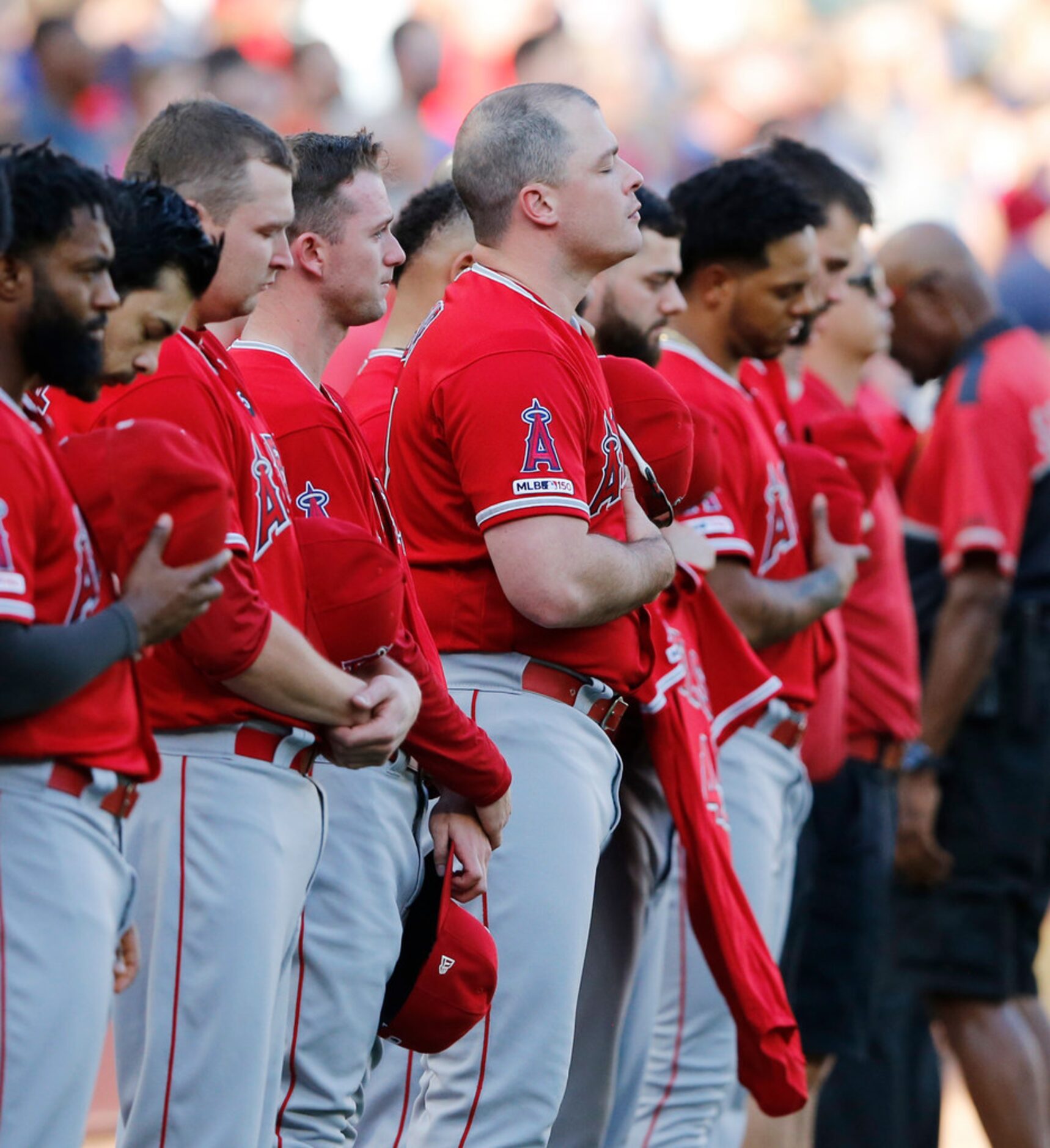 Los Angeles Angels Justin Bour (41) and teammates during a moment of silence for fellow...