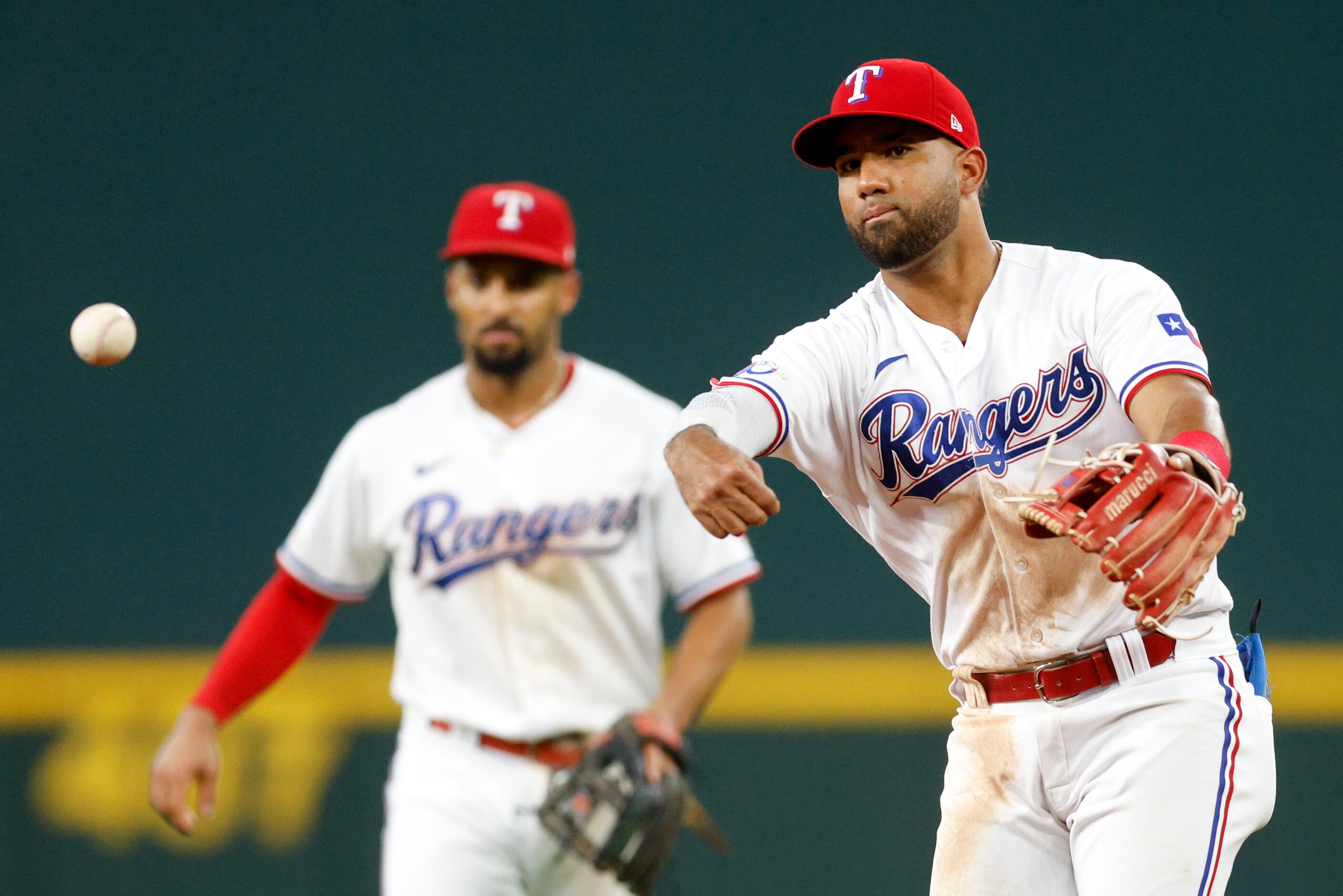 Texas Rangers third baseman Ezequiel Duran (70) throws the ball to first during the sixth...