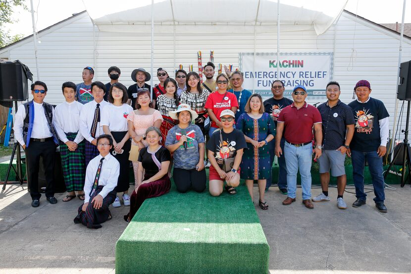 Members of the Kachin ethnic group pose for a picture during a community fair and fundraiser...