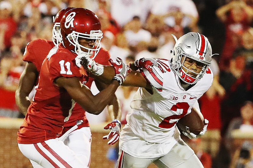 NORMAN, OK - SEPTEMBER 17:  Dede Westbrook #11 of the Oklahoma Sooners tackles Marshon...