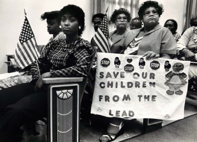 Ina Bell Daniels McGee (center, holding flag) and sister Nina Nell Daniels Webster at a 1983...