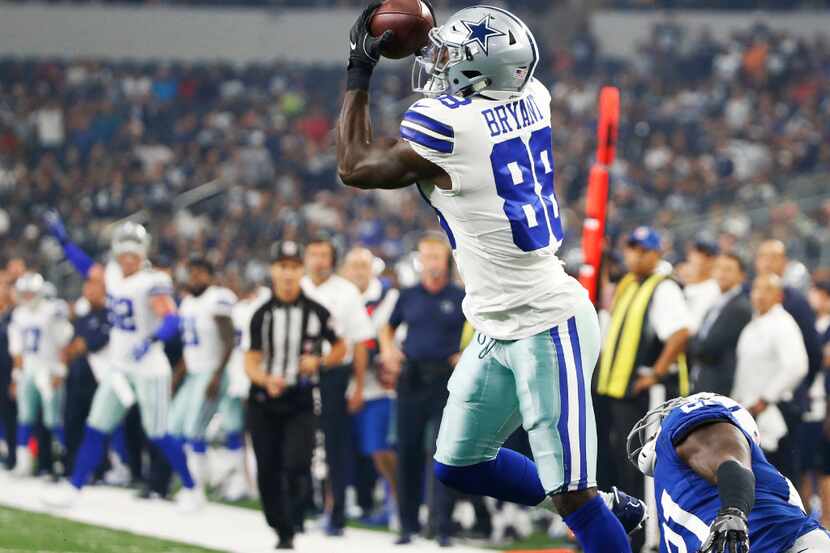 Dallas Cowboys wide receiver Dez Bryant (88) catches a deep ball for a touchdown as he is...