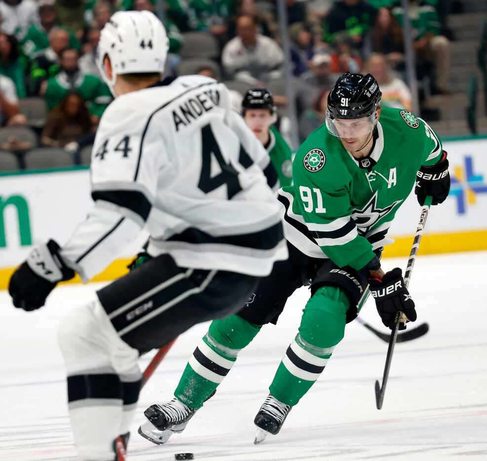 Dallas Stars center Tyler Seguin (91) takes a pass and skates by Los Angeles Kings...