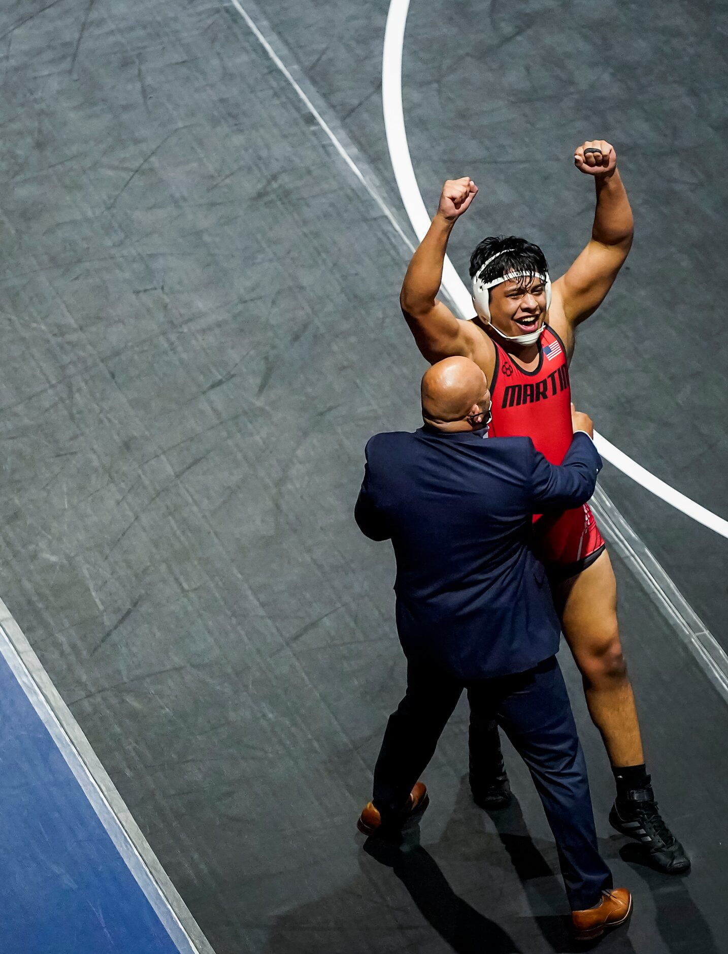 Maxwell Soto of Arlington Martin celebrates after defeating Isaiah Steel of Allen for the 6A...