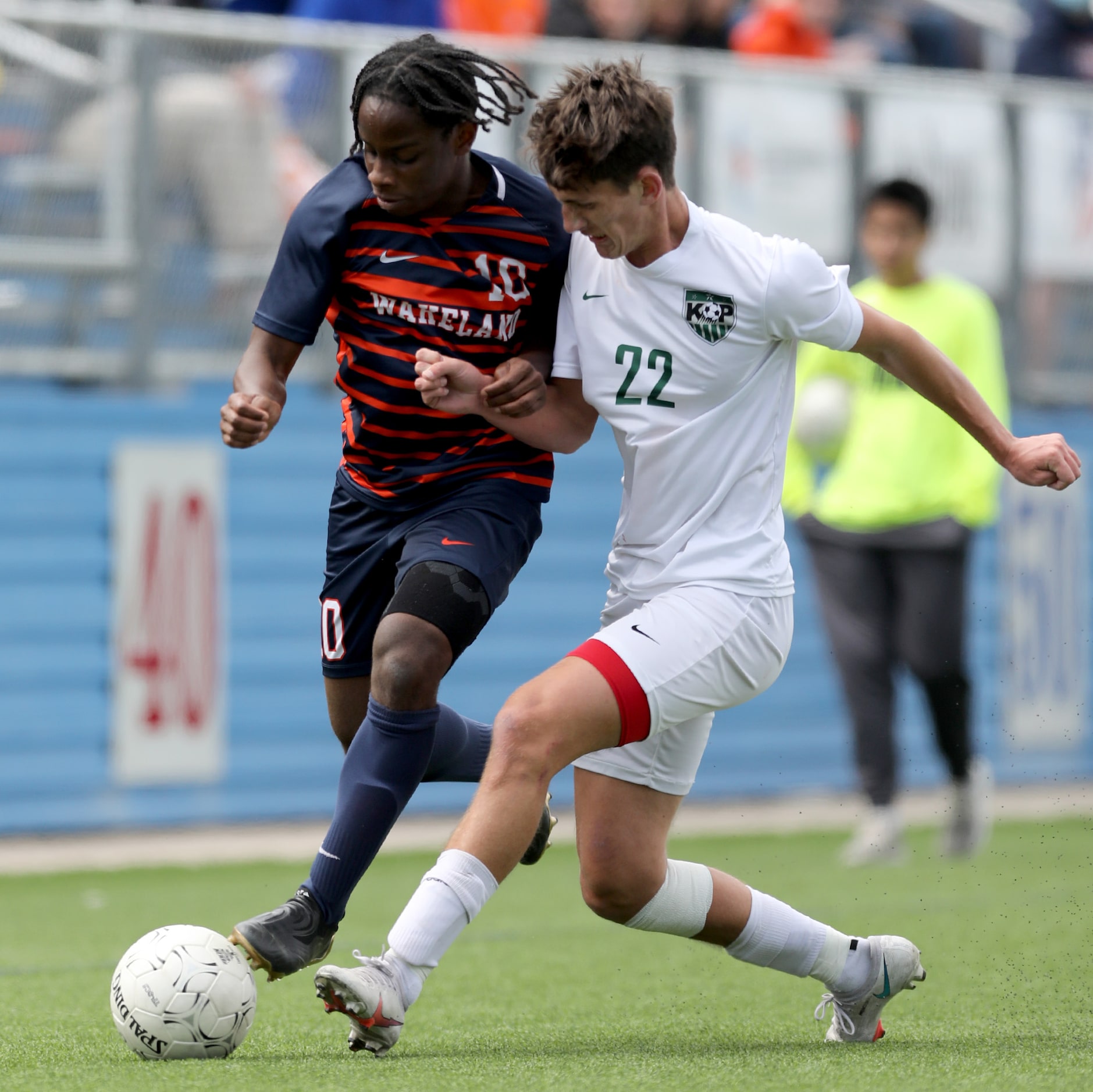 Frisco Wakeland's Marlon Williams (10) and Humble Kingwood Park's Tony Sterner (22) struggle...