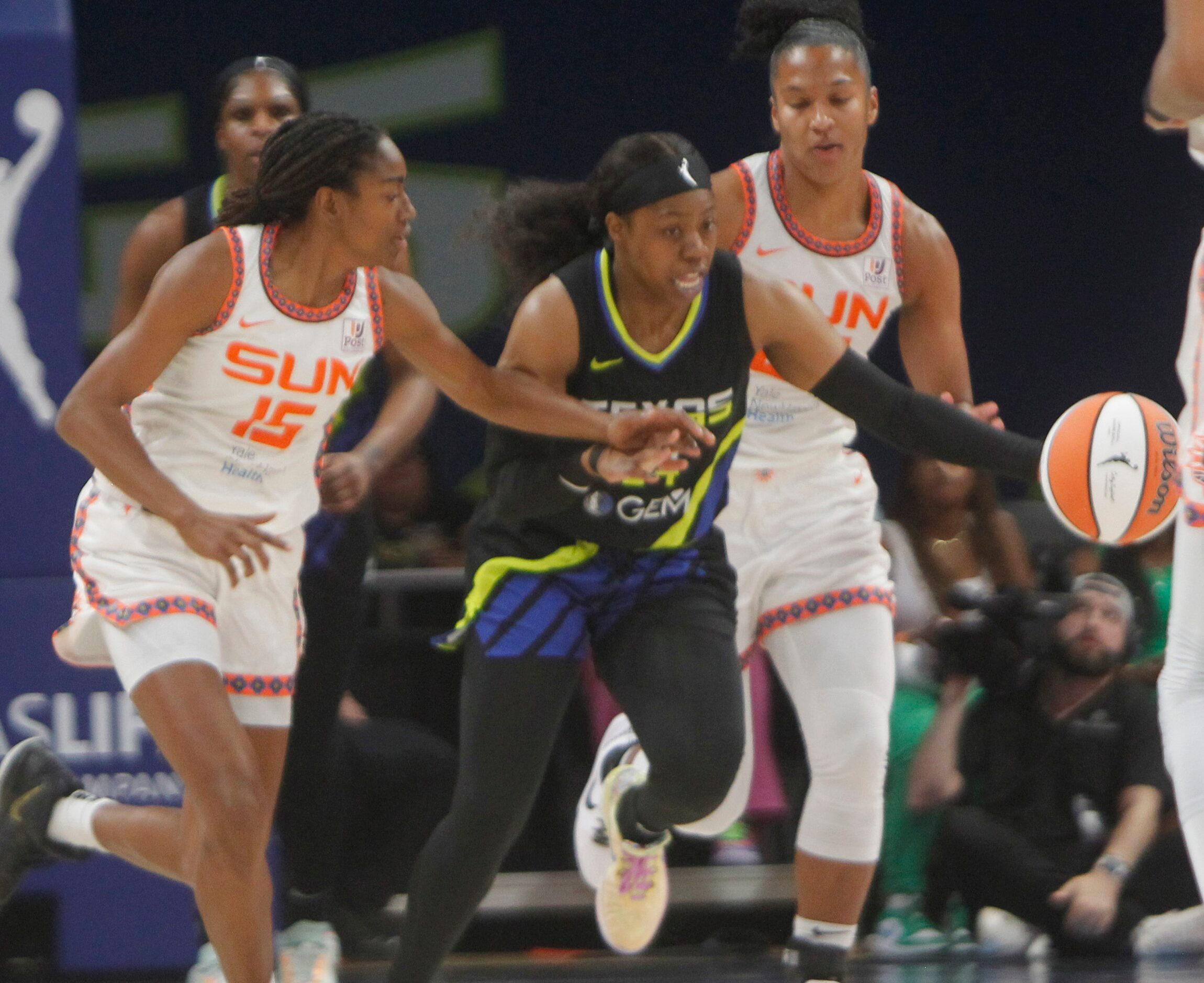 Dallas Wings guard Arike Ogunbowale (24) steals the ball from Connecticut Sun guard Tiffany...