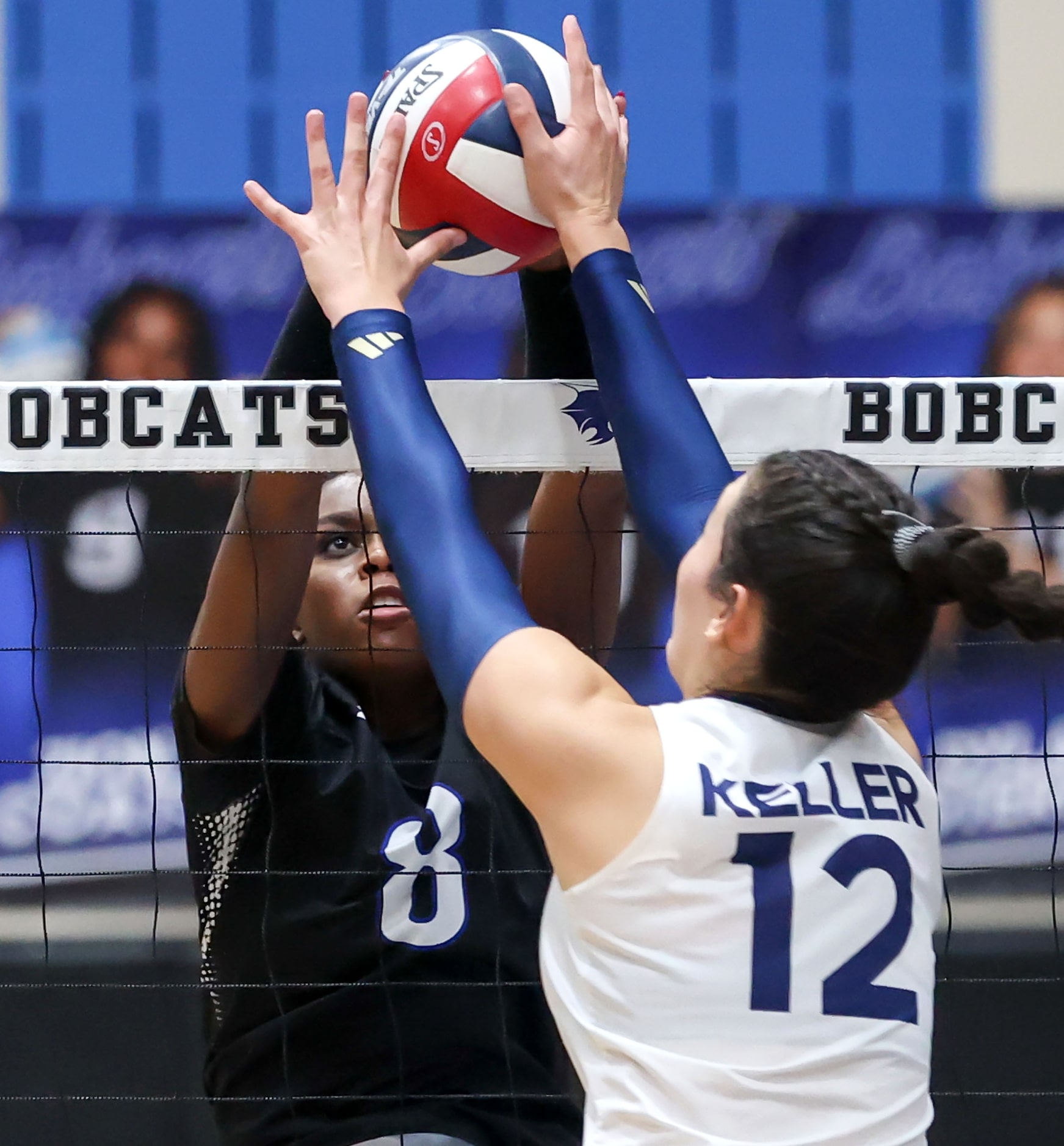 Byron Nelson's Rayvyn Thomas (8) and Keller's Anna Flores (12) go for a block during a...