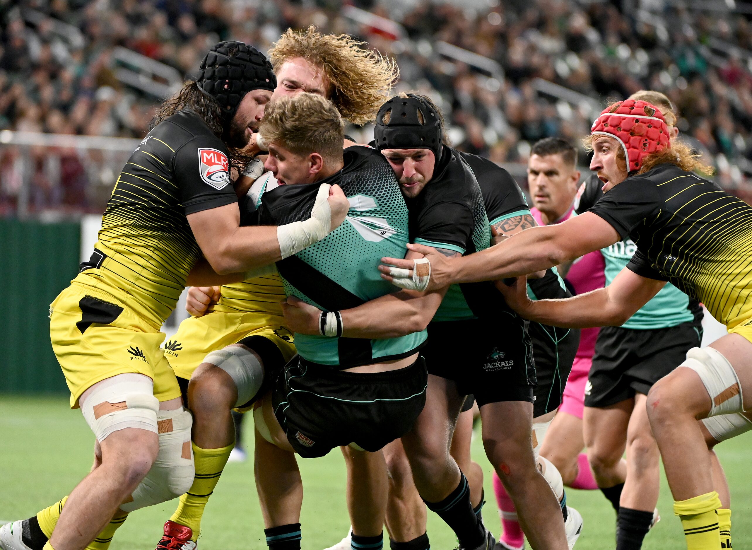 Dallas’s Michael Matarazzo (6) is tackled while running in for a try during a Major League...