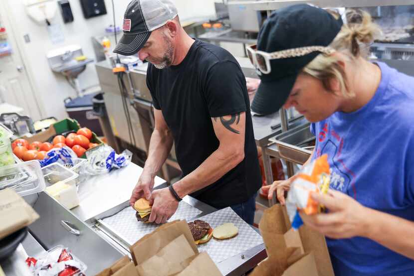 York 'N Ale Burgers restaurant owner Travis Middlebrooks (left) and Valley View Elementary...