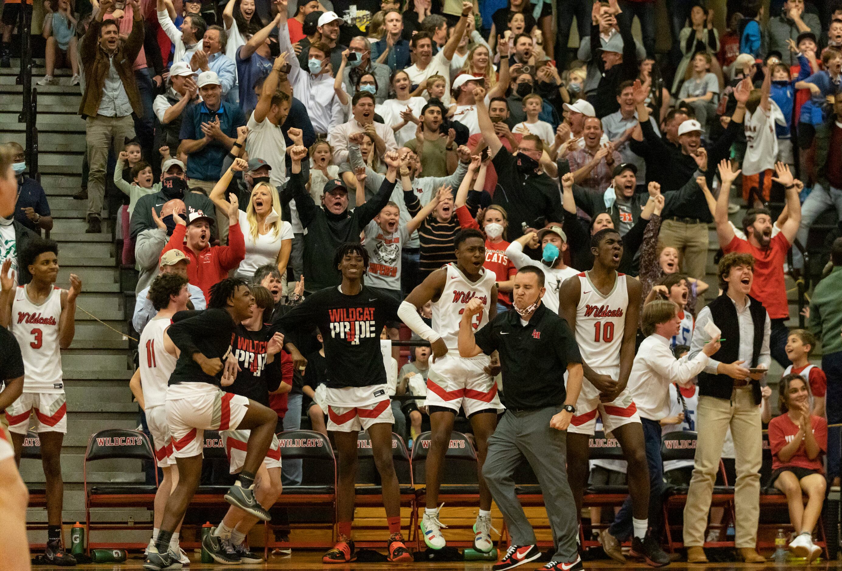 Lake Highlands High School players and fans react as Lake Highlands ties up the game in the...