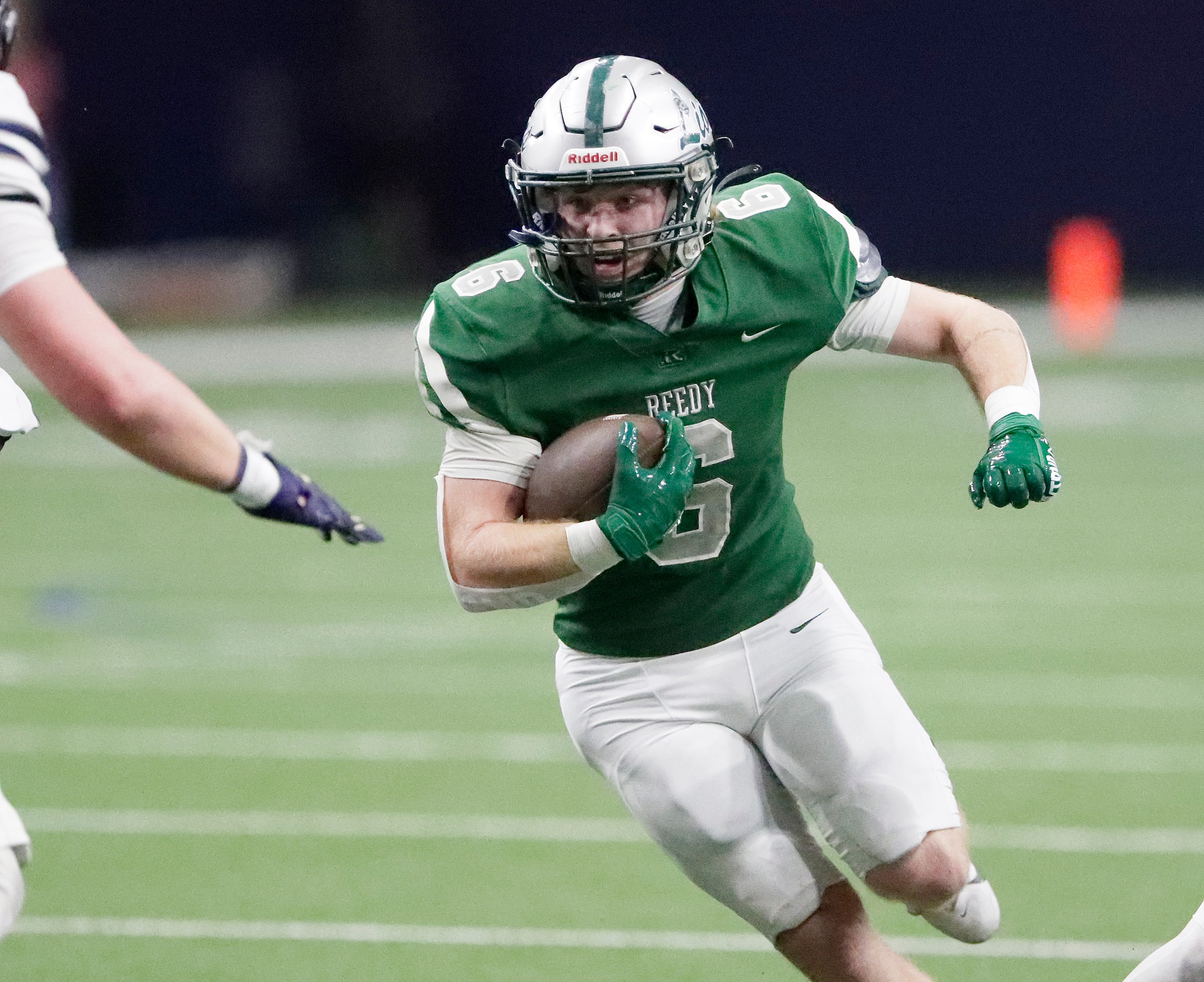 Reedy High School running back Cade Hebel (6) prepares for contact during the first half as...