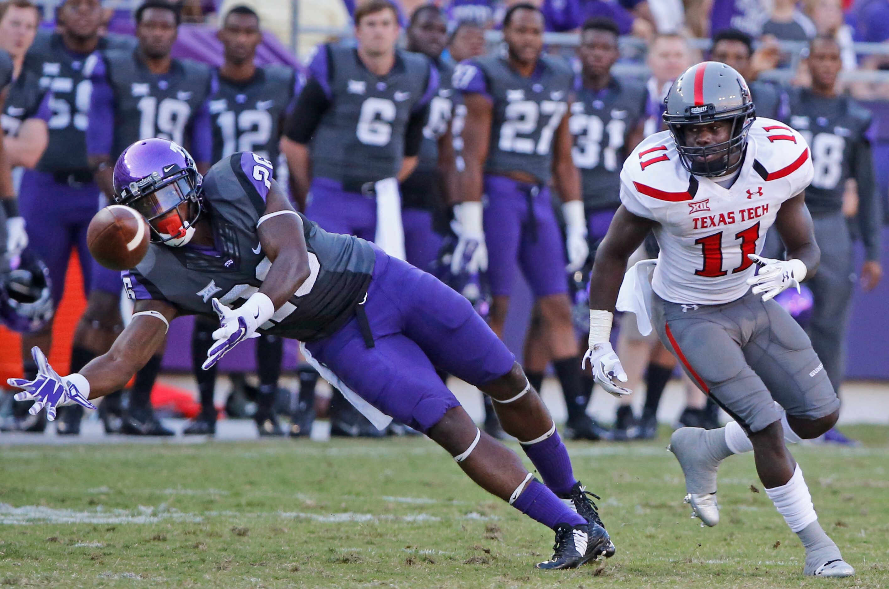 TCU safety Derrick Kindred (26) breaks ups pass intended for Texas Tech receiver Jakeem...