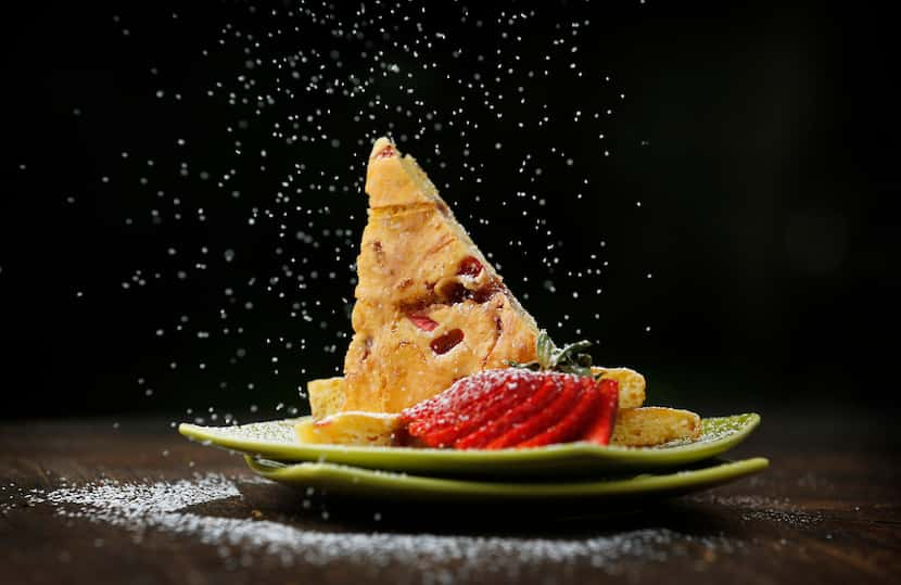 Strawberry swirl baked pancake with a dusting of powdered sugar