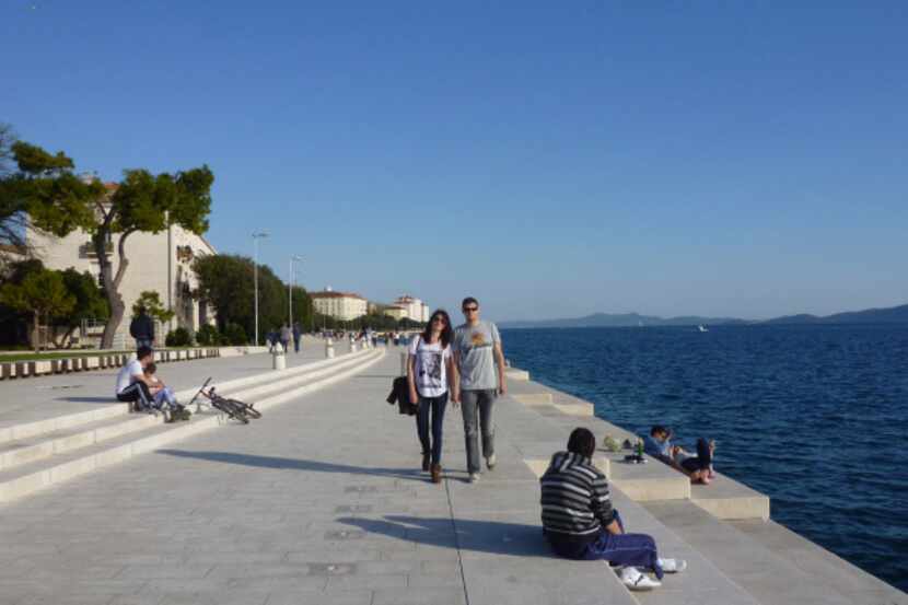 The ‘Riva’ in Zadar, Croatia attracts locals and visitors alike, with its views over the...