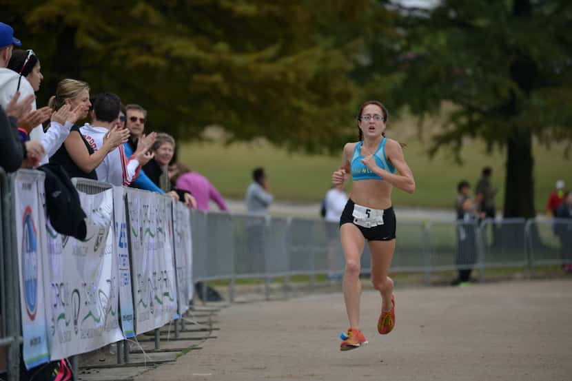 Ingrid Mollenkopf finishes first in the half-marathon's female division during the Dallas...