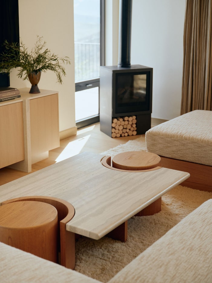 Close up of living room table with linear design and two circular end points. Console table,...