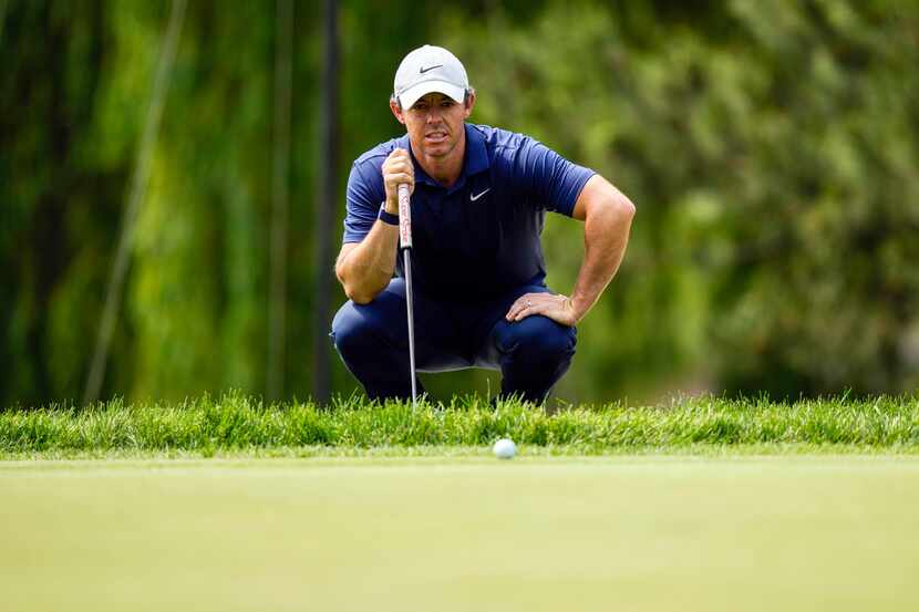 Rory McIlroy lines up a putt on the sixth hole during the third round of the Canadian Open...