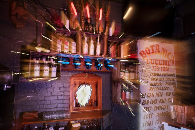 A photograph made with a slow camera shutter behind the bar at the Spirits Room inside Las...