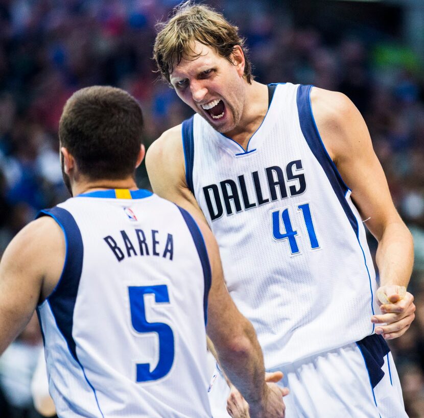 Dallas Mavericks forward Dirk Nowitzki (41) celebrates with Dallas Mavericks guard J.J....