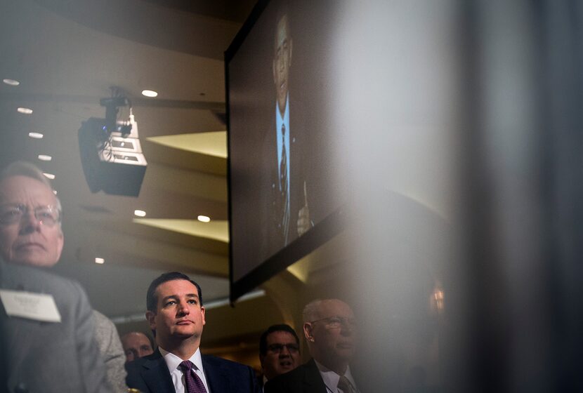 Sen. Ted Cruz, center, (R-Texas) listens as President Obama gives opening remarks during the...