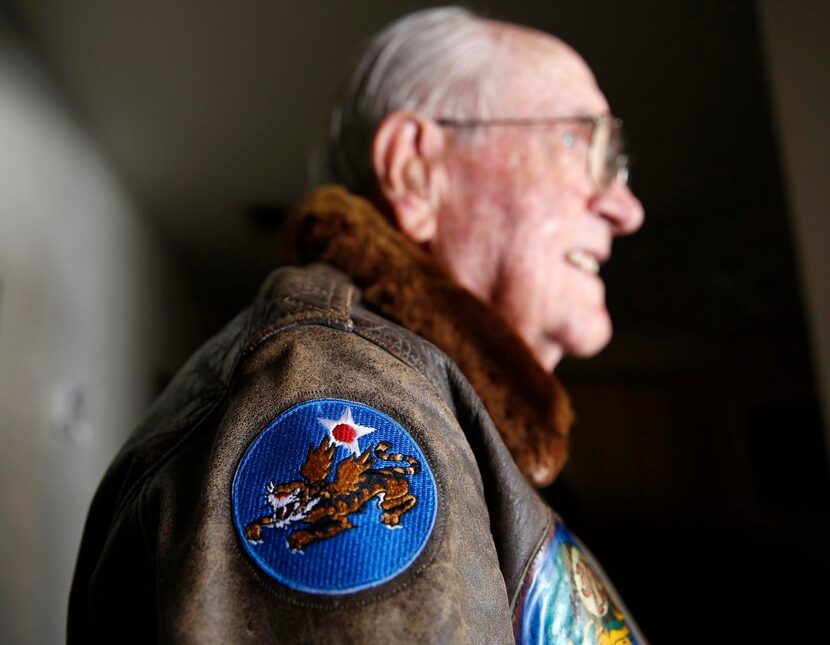 
Leroy Parramore, 91, a World War II veteran, shows his Flying Tiger patch on his flight...