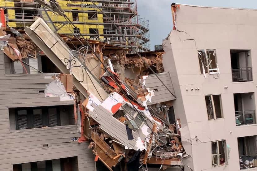 Injuries were reported after a crane fell into the Elan City Lights apartment building in...