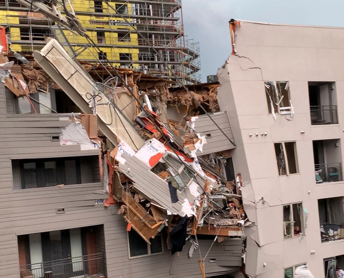 Injuries were reported after a crane fell into the Elan City Lights apartment building in...