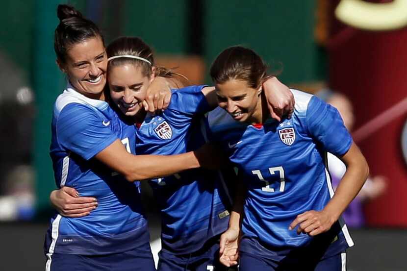 FILE - In this April 4, 2015, file photo, United States Morgan Brian, center, is...