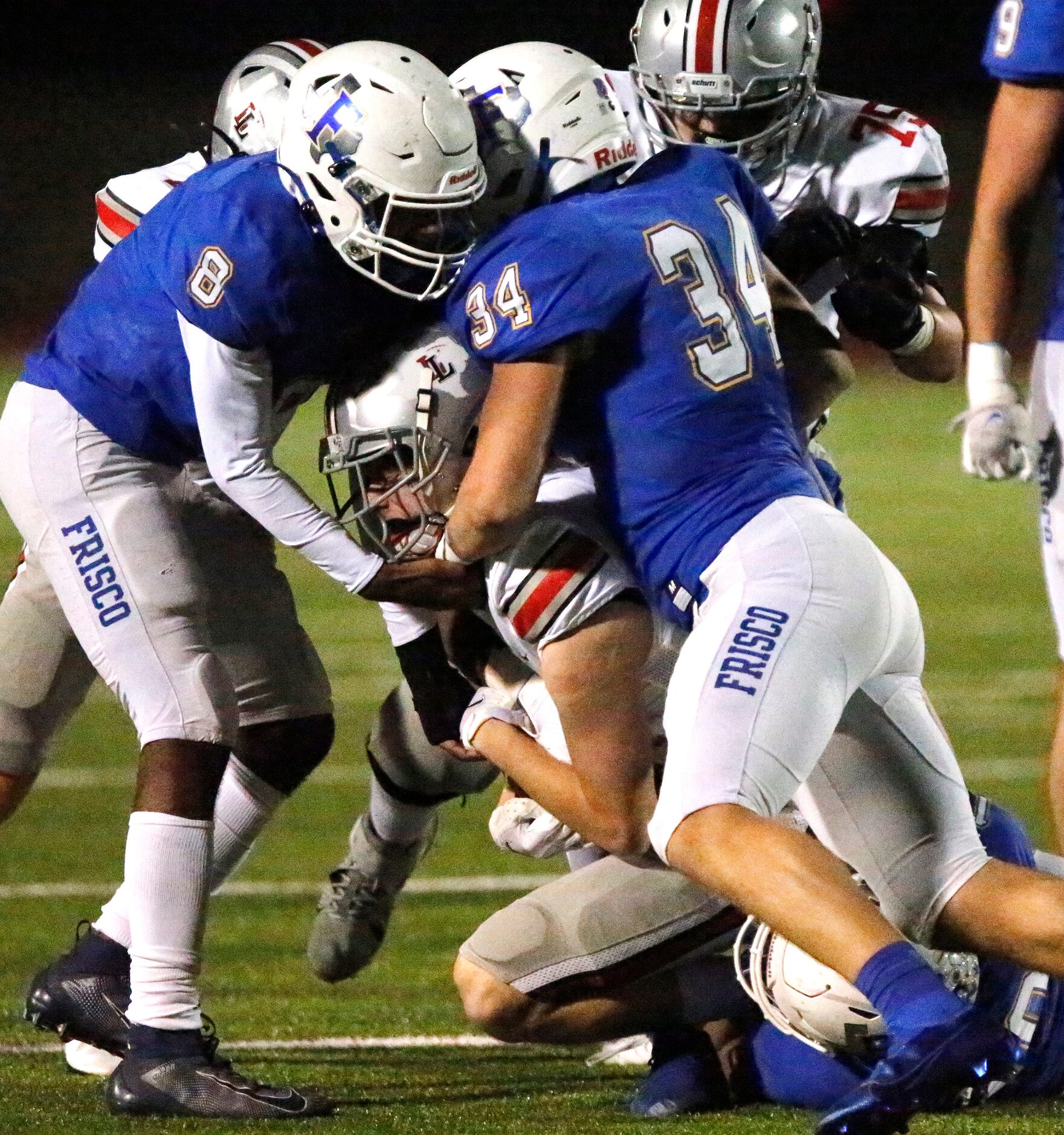 Lovejoy High School wide receiver Reid Westervelt (7) is tackled after the catch by Frisco...