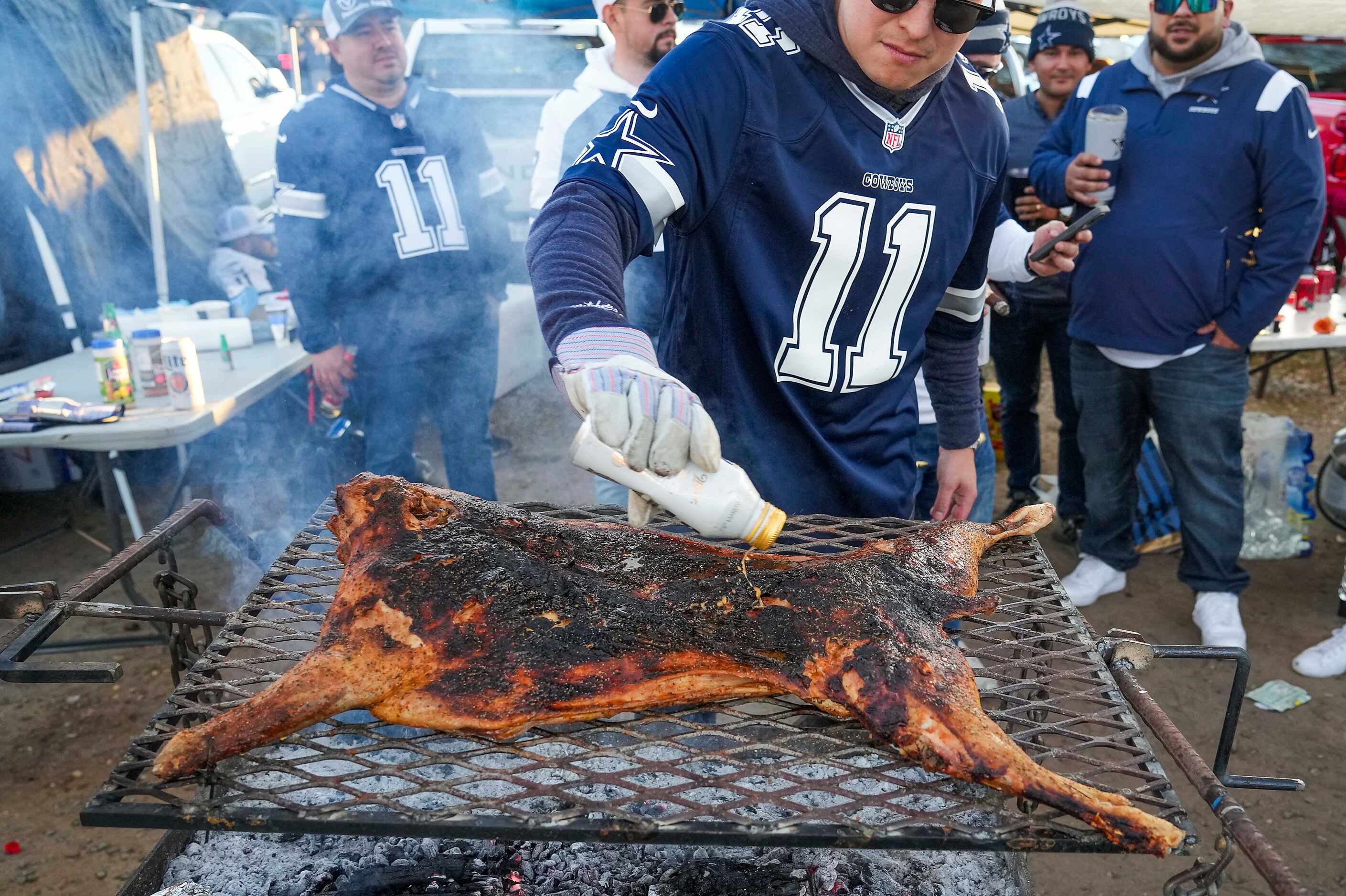 Fans tailgate before an NFL football game between the Dallas Cowboys and the Philadelphia...