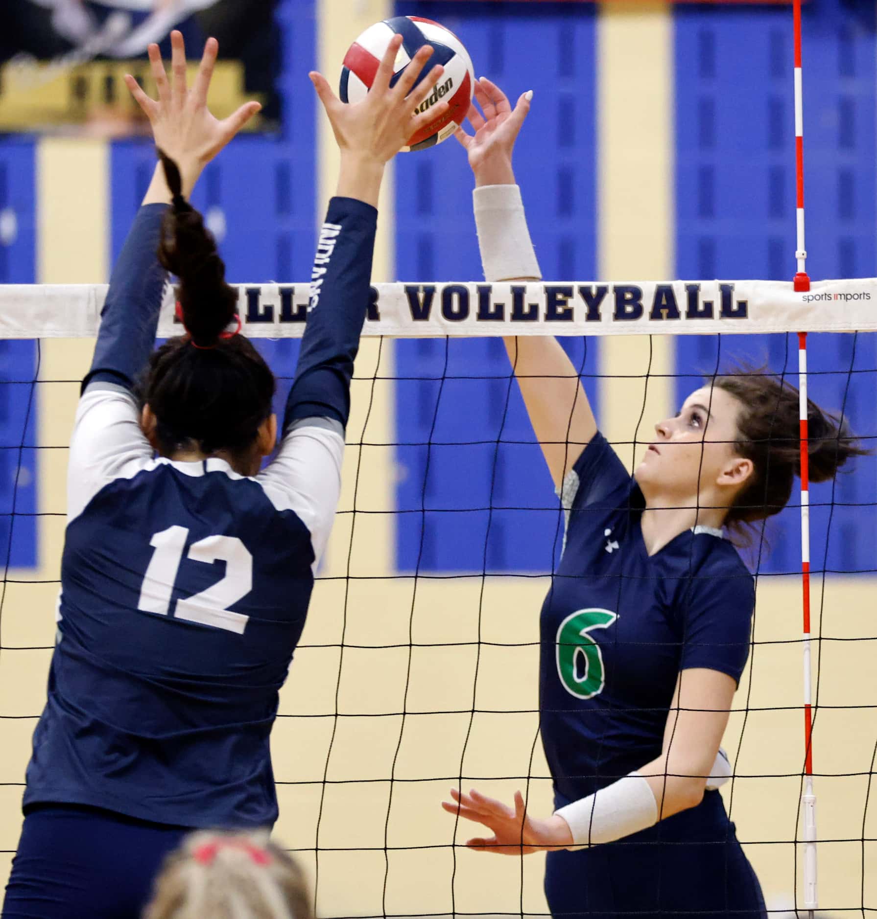 Eaton High’s Payton Sandifer (6) attempts to spike the ball past Keller High’s Anna Flores...