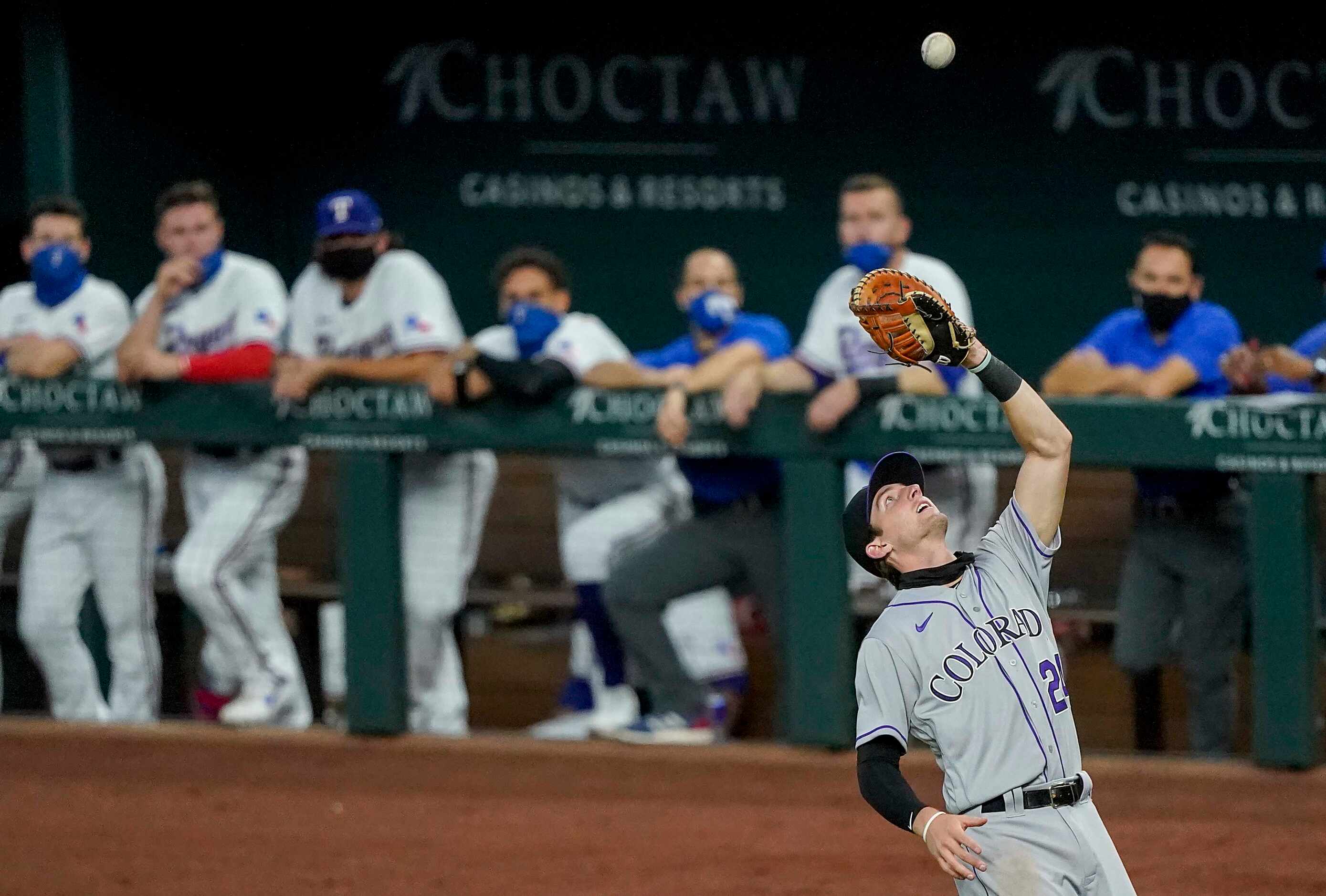 Colorado Rockies first baseman Ryan McMahon makes the lpay on a popup in foul territory off...