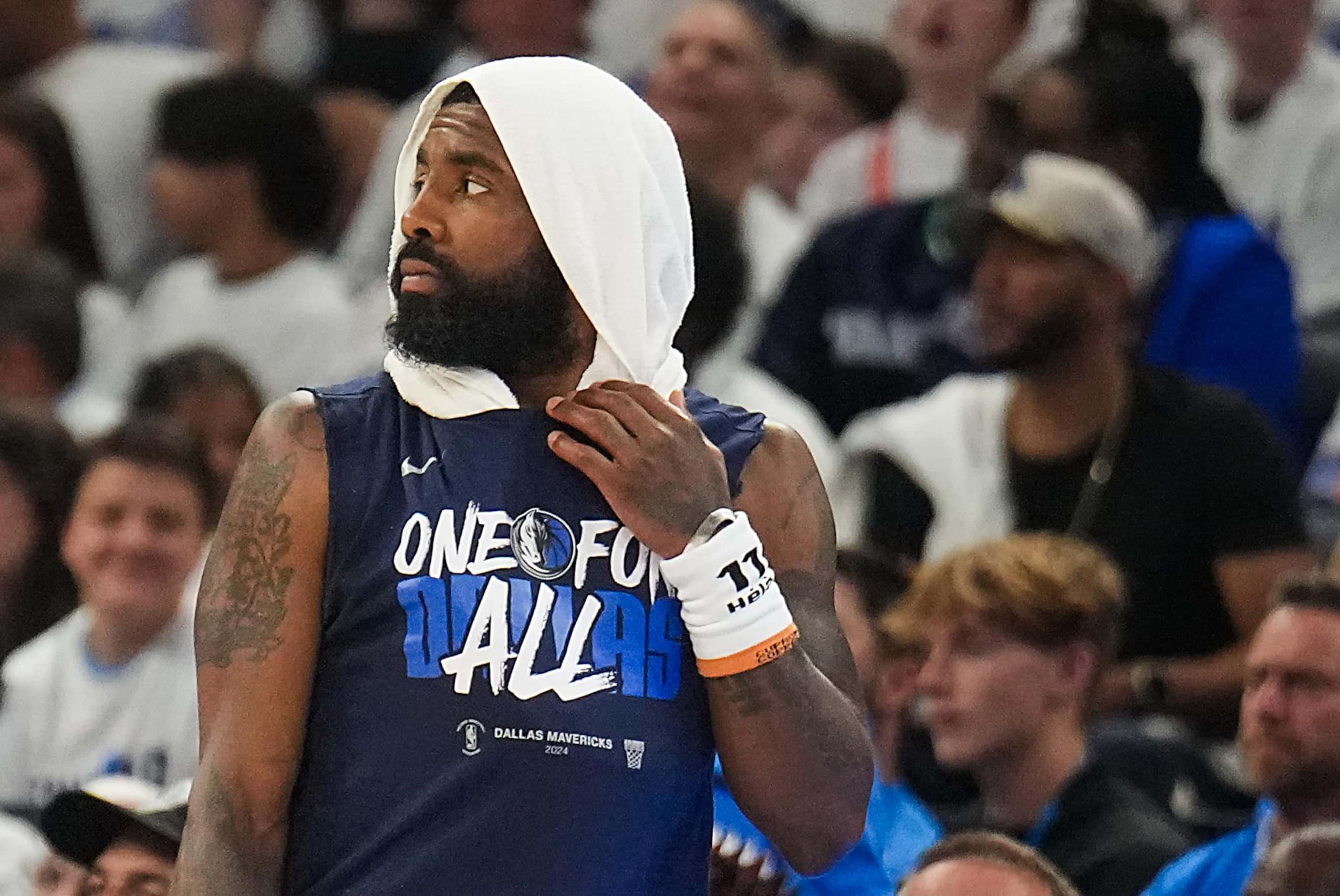 Dallas Mavericks guard Kyrie Irving checks into the game during the first half of Game 1 of...