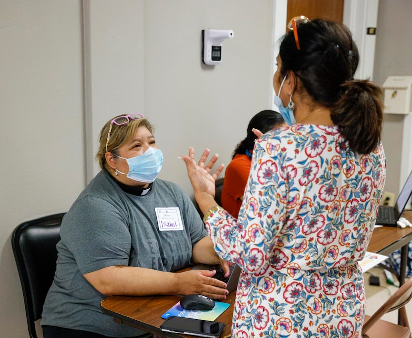 Rev. Isabel Marquez speaks with Almas Muscatwalla, a leader in Dallas Responds, while making...