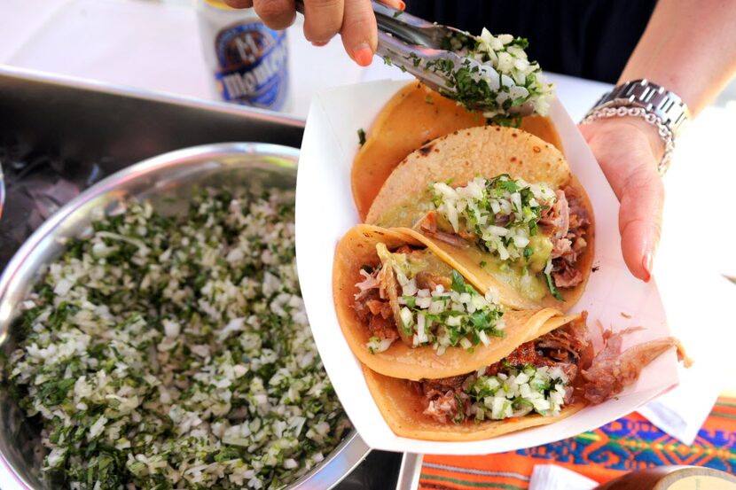 Barbacoa tacos from Urban Taco feature cilantro, onion, and lime at Taco Libre at Main...