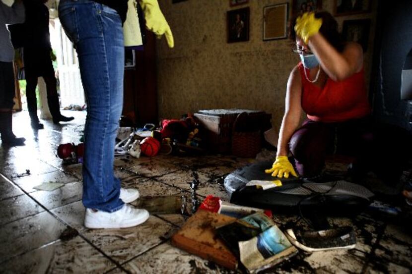 Diane Mitchell went through what was left of her family's belongings after Hurricane Ike hit...