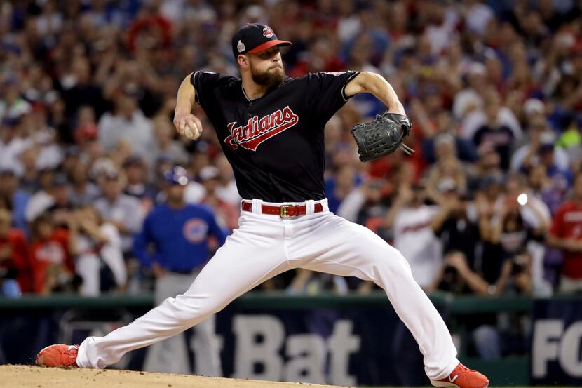 FILE - This Nov. 2, 2016 file photo shows Cleveland starting pitcher Corey Kluber throwing...