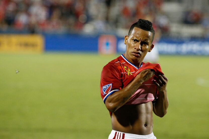 FC Dallas midfielder Michael Barrios (21) stares at the referee after getting elbowed in the...