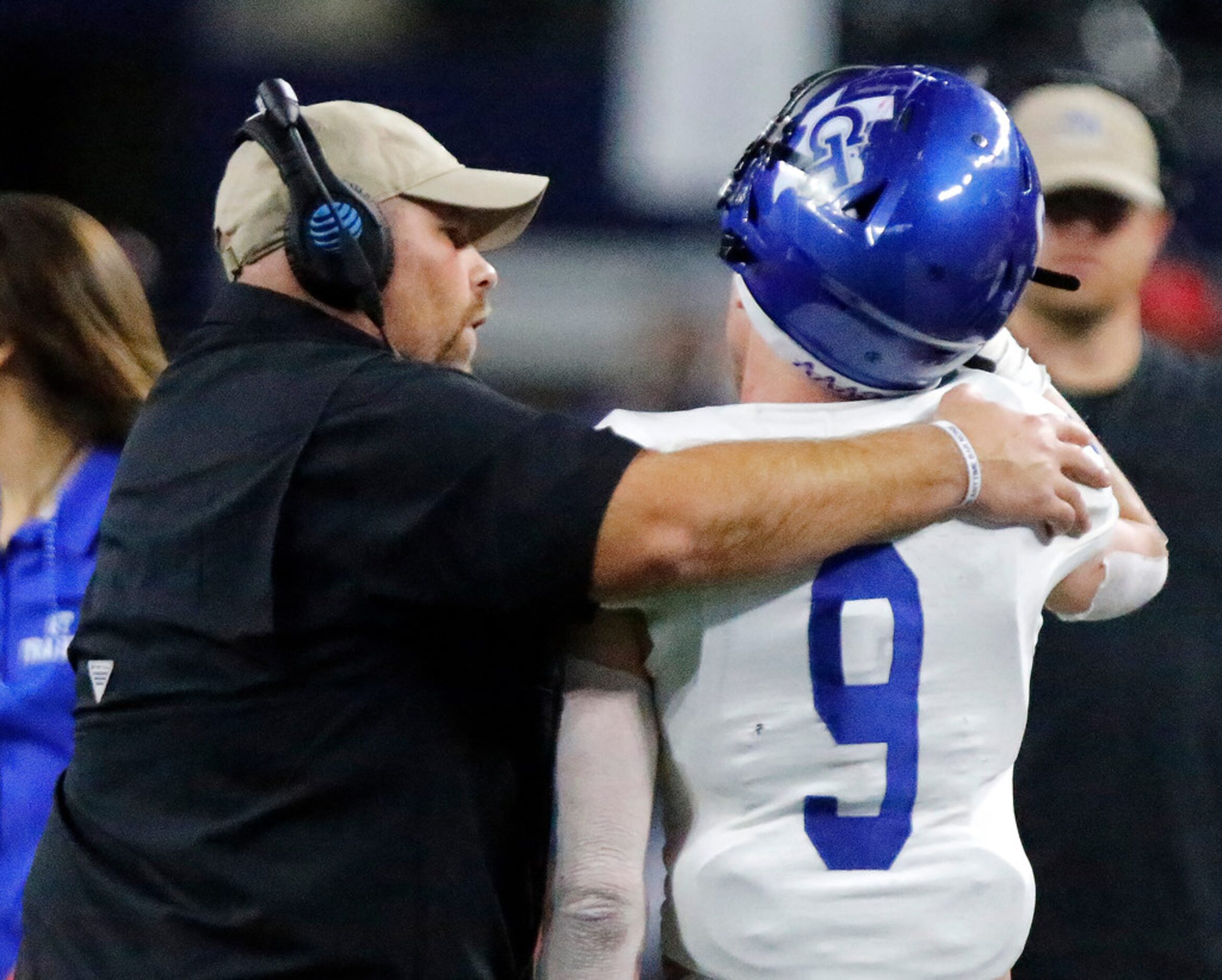 Gunter High School head coach Jake Fieszel talks to Gunter High School linebacker Grant...