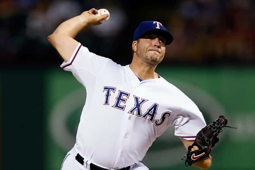 Texas Rangers closer Shawn Tolleson delivers to the San Diego Padres during the ninth inning...